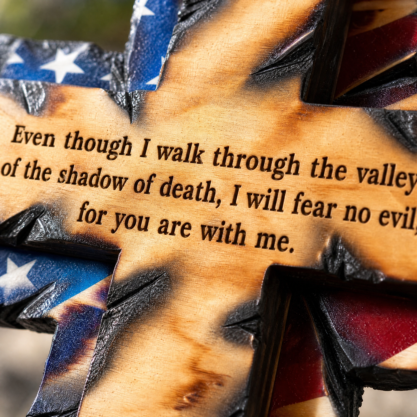 Engraved Psalm 23 verse on the torch-burned beam
