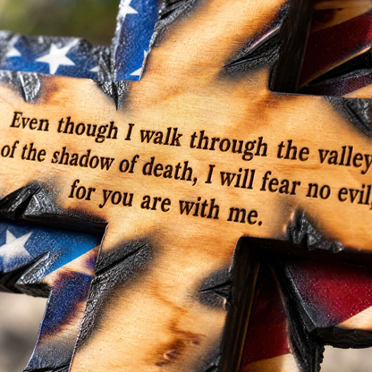 Engraved Psalm 23 verse on the torch-burned beam