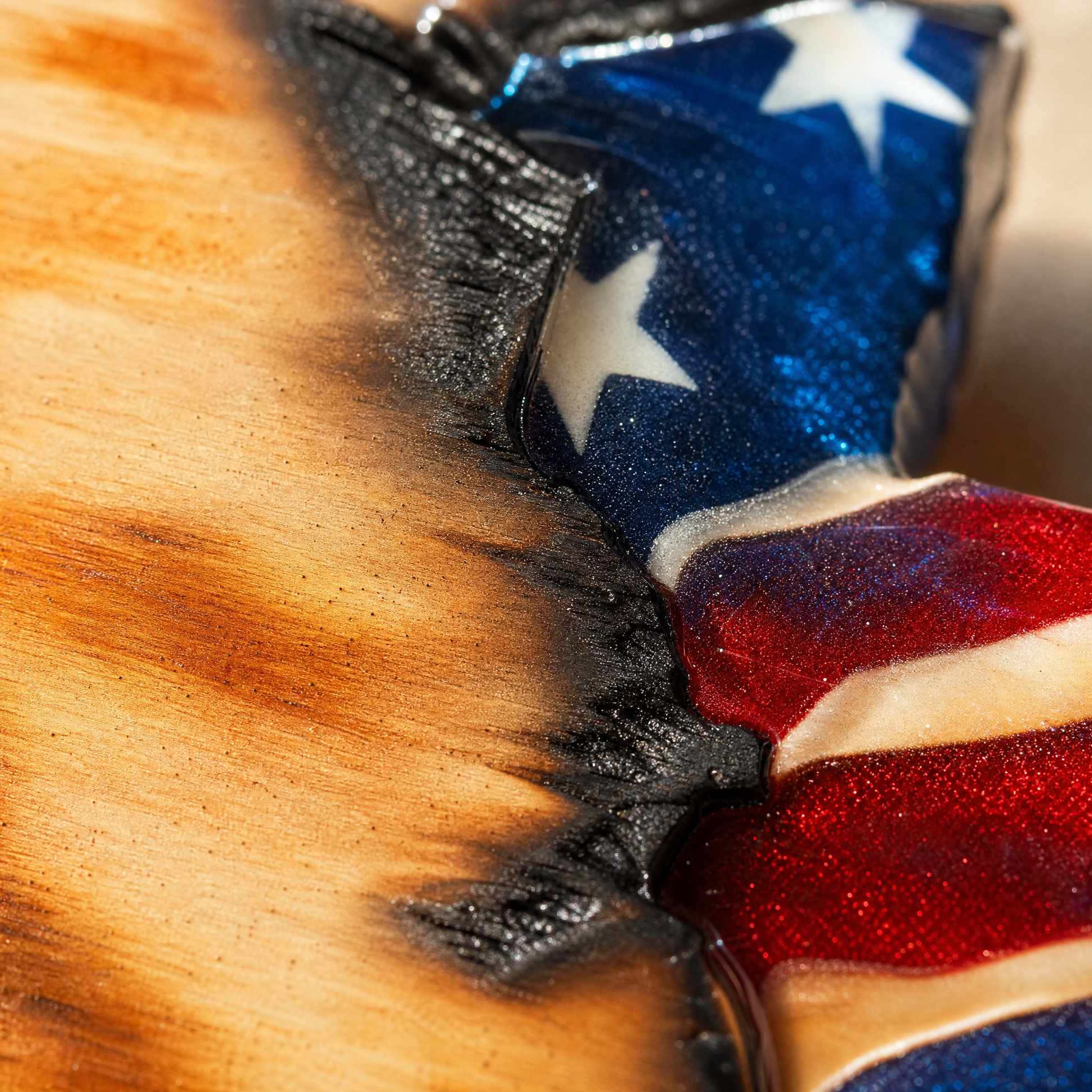 Torch-burned wood grain and charred hand-torn edge