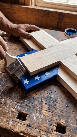 Hand-painting the flag’s blue canton