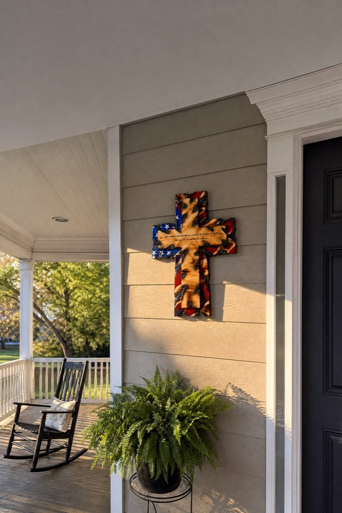 Tattered Flag Cross on a covered front porch
