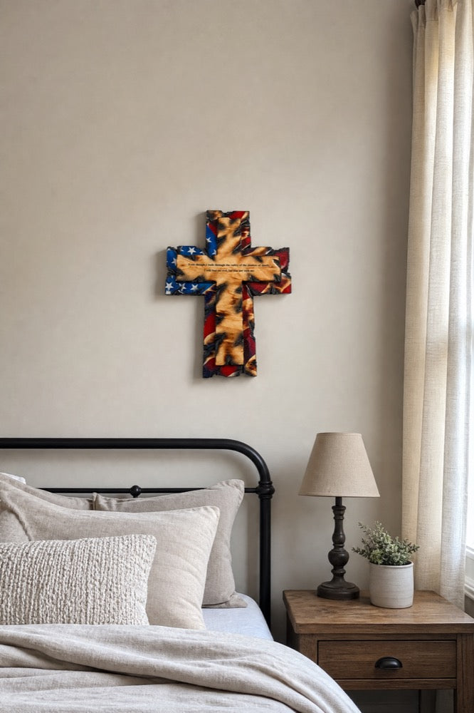 Tattered Flag Cross above a bedroom headboard